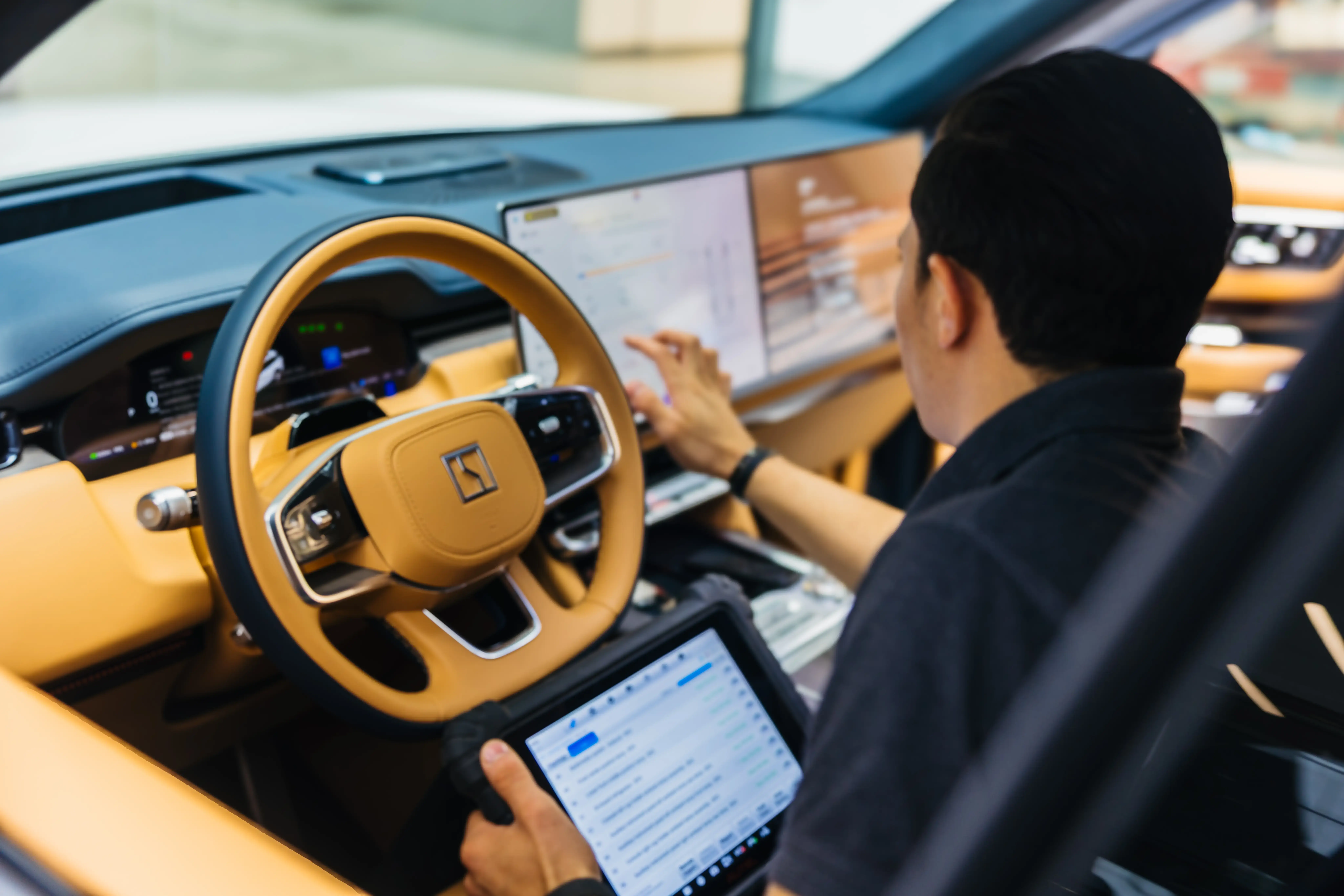 Electric vehicle being inspected and maintained during summer conditions