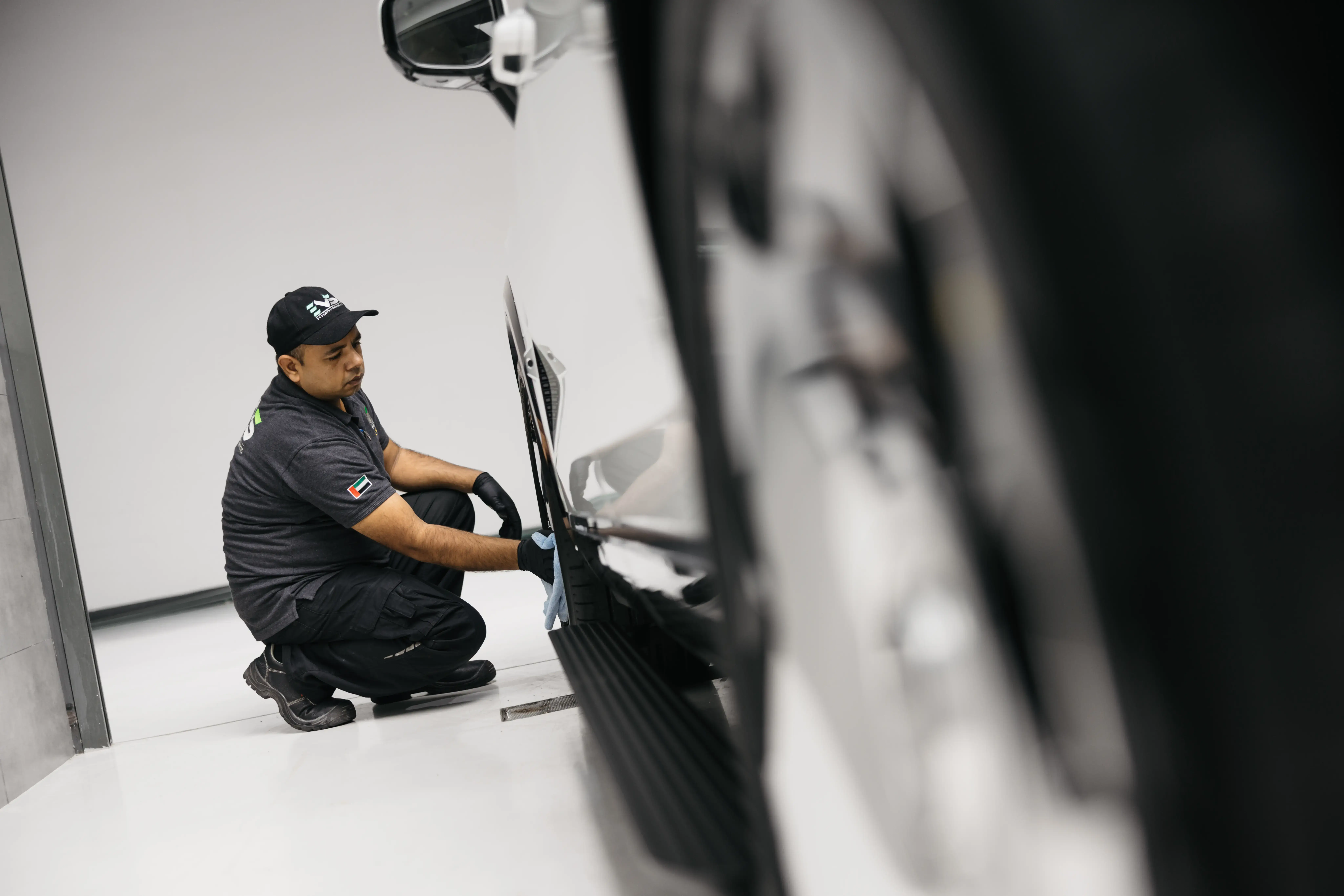 Electric vehicle undergoing routine maintenance and diagnostics at an EV service center in UAE